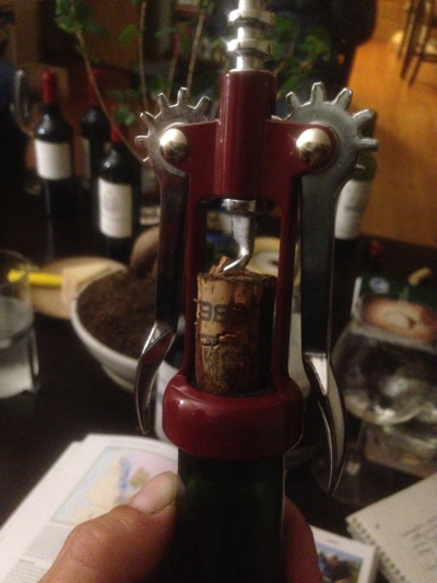 Bordeaux cork coming out of bottle